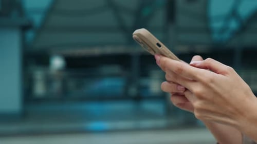 Woman Using Mobile Phone in Urban Setting