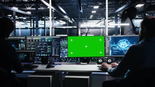 Data Center Engineer Working on Neural Network on Green Screen PC