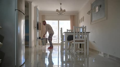 Man Mopping Floor at Home