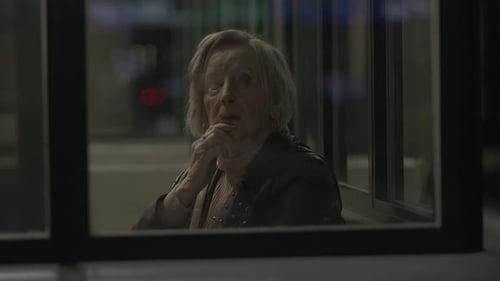 Patience of an Elderly Lady As She Waits for the Train to Arrive
