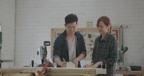 Two carpenter teamwork building design wood house model measure scale size