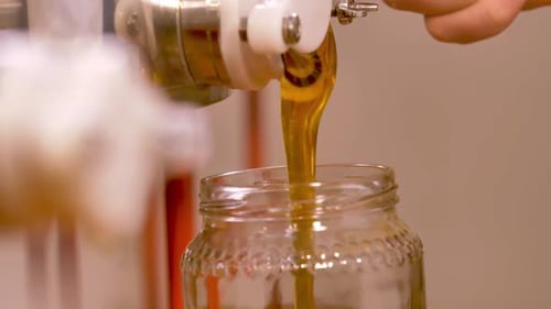 pouring homemade honey