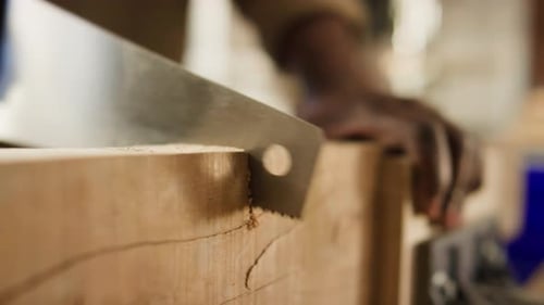 Close Up of Handsaw Cutting Timber