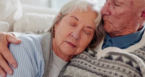 Loving Senior Couple Embracing Tenderly Indoors