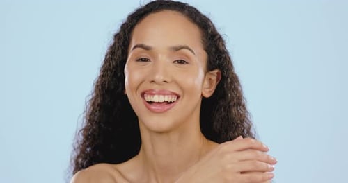 Smiling Young Woman with Curly Hair Posing