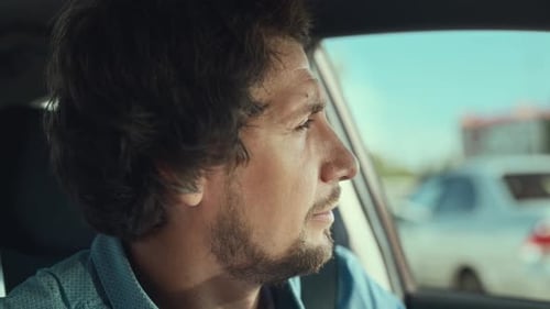 Man Driving Car on a Sunny Day