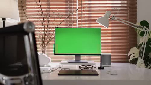 Dolly in computer display monitor with green screen chroma key mock-up.