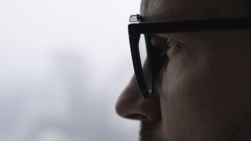 Man in Glasses Looking Towards the Future