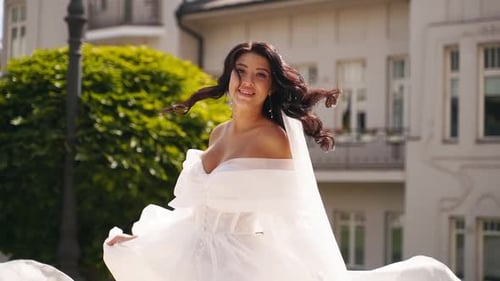 Beautiful Bride in White Dress Smiling Outdoors
