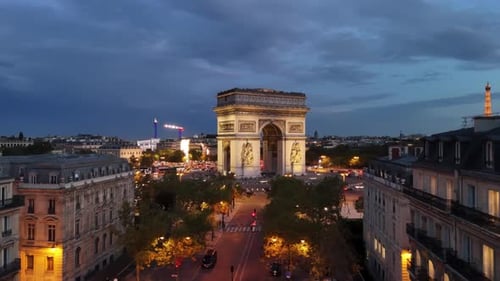 Drone night view of Arc de Triomphe (Arch of Triumph) in Paris, France