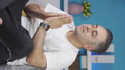 Adult Man Meditating in Casual Indoor Setting