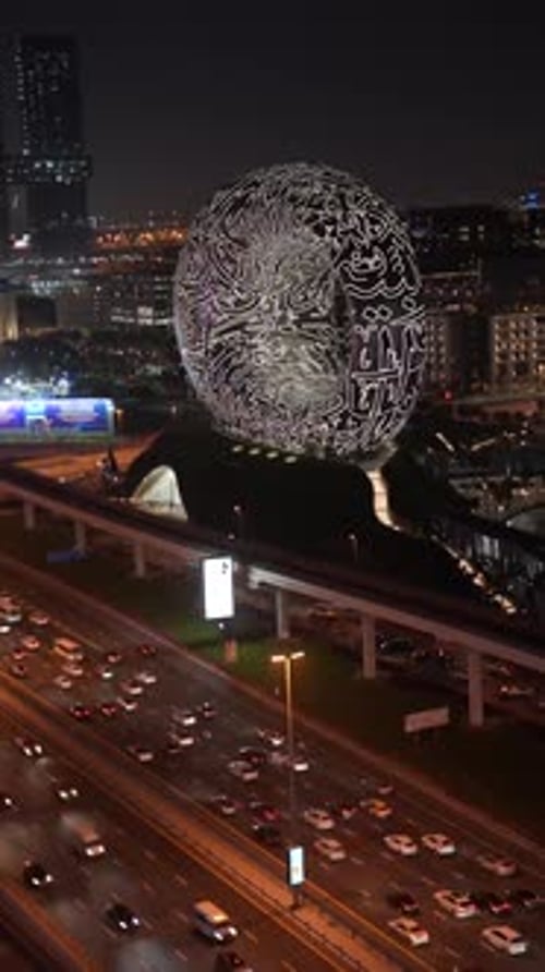 Timelapse on the Museum of the Future building with Sheikh Zayed Road. At night time in Dubai