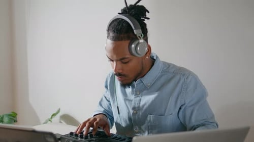 Man Using Midi Keyboard To Create Music