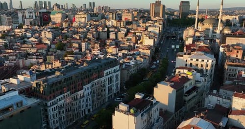 Drone footage flying over the city of Istanbul for sunset. Capturing the cars and surrounding buildi