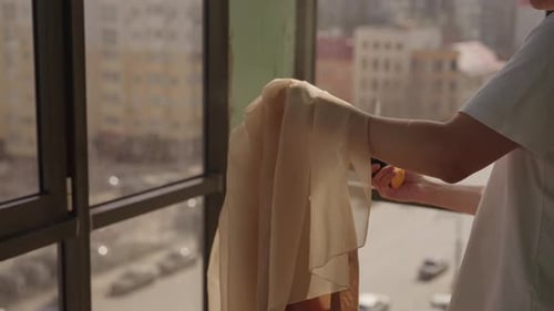 Steaming Garment in Apartment for Fashion or Design Project