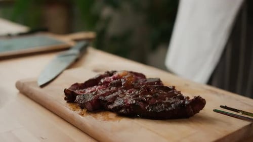 Juicy Sliced Steak on a Cutting Board