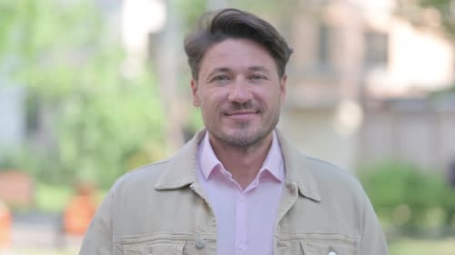 Man Giving Thumbs Up Outside