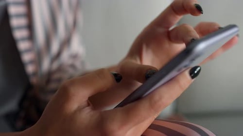 Woman using mobile phone, close up shot
