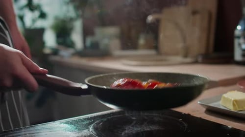 Vegetables Stir Frying in a Pan in Kitchen