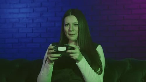 Enthusiastic Woman Plays Video Games at Home