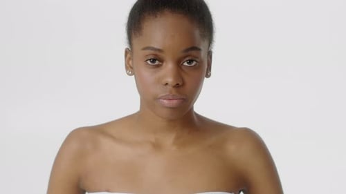 Woman with Short Dark Hair Looking at Camera