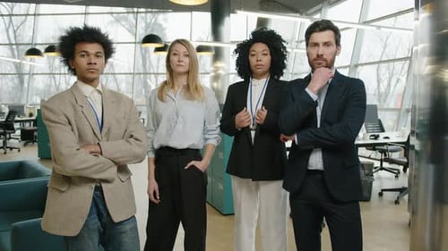Male and Female Professionals in Formal Suits Working in Modern Office