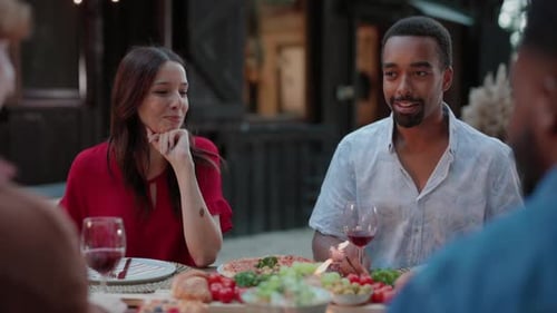 Diverse Group of Friends Enjoying Meal Together