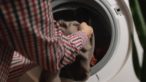 Laundry Washing Concept Female Hands Load Dirty Laundry Into Washing Machine