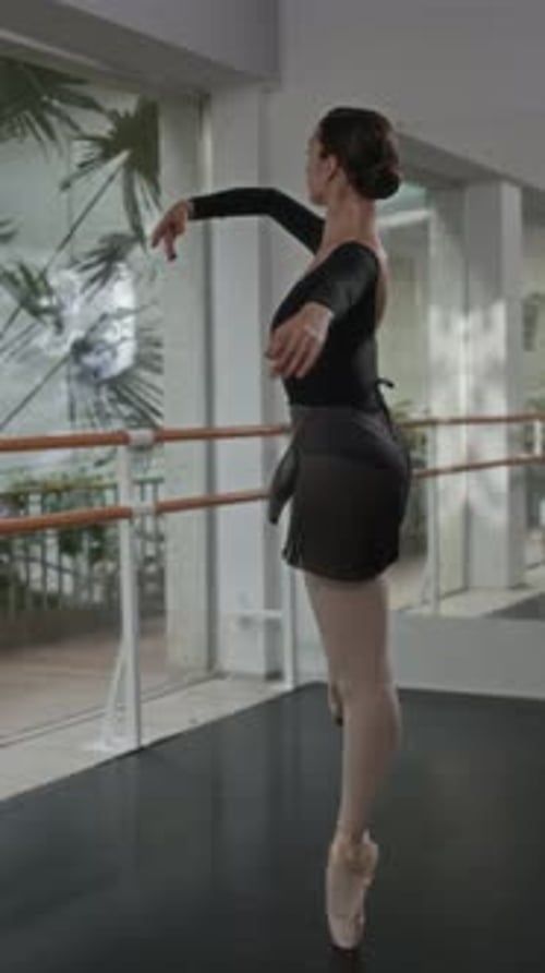 Ballerina Dancing Actively in Studio