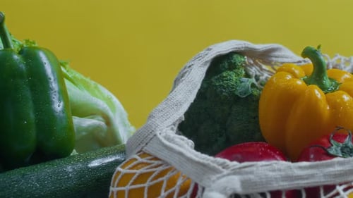 Vegetables in Grocery Bags, Isolated on Yellow, No People