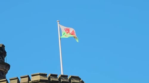 Welsh Flag Waving Proudly on a Castle