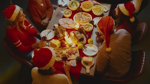 Top view of big family celebrate Christmas festival with member at night and look like they join din