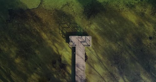 Alone guy sitting on the bridge