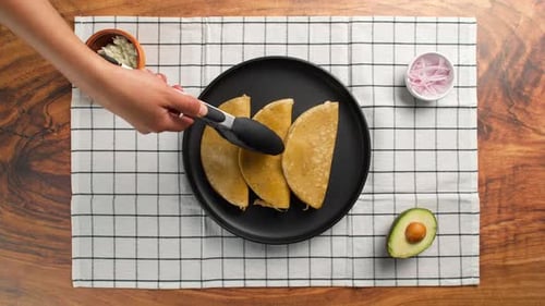 Green Enchiladas, Mexican Woman Places A Fried Tortilla Stuffed With Chicken On A Plate
