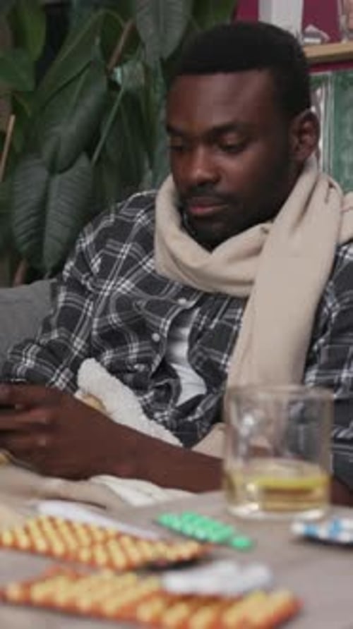 Enjoying a Cozy Evening While Wrapped in a Warm Blanket with Drinks and Good Company