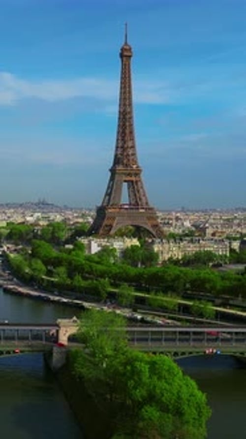 Vertical Video Aerial View of Tour Eiffel Tower and Seine River Bridge and Historical City Center