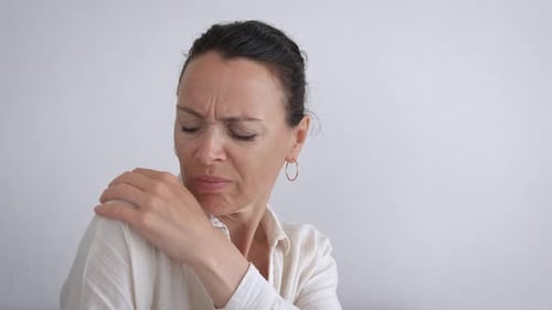 Female with Pain Attack in Shoulder
