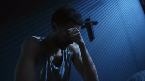 Sad Man Crying With Rosary Beads At Night