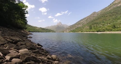 Beautifull scenery in Huesca Pyrenees. Lake reflection of mountains in a summer evening with clear s