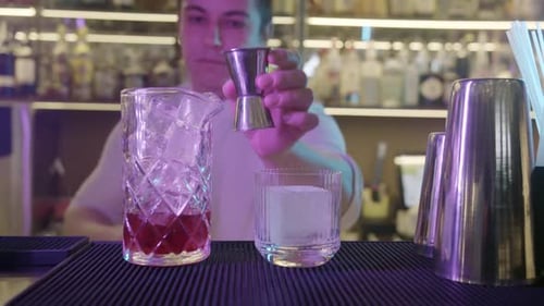 Bartender Making Cocktails in Bar