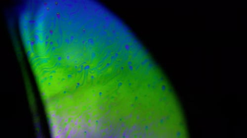 4k stable shots of soap balloons showing the colors of the macro world through a microscope perspect