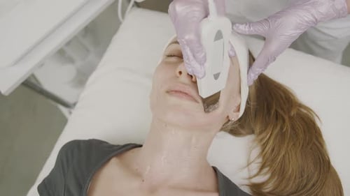 Girl receives advanced permanent makeup treatment at a professional cosmetology studio