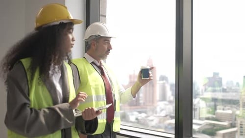 Engineers work in high rise building.