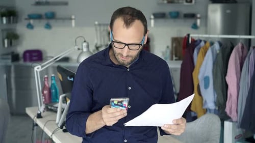Young Professional Analyzing Finances at Home