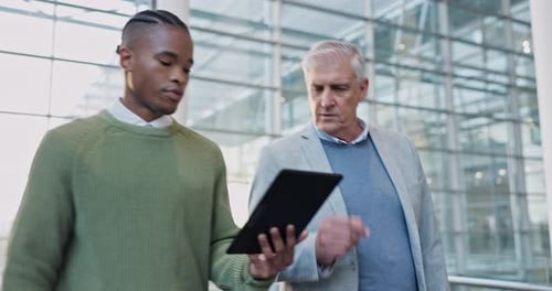 Tablet, partnership and manager speaking to a businessman on a corporate project in the office