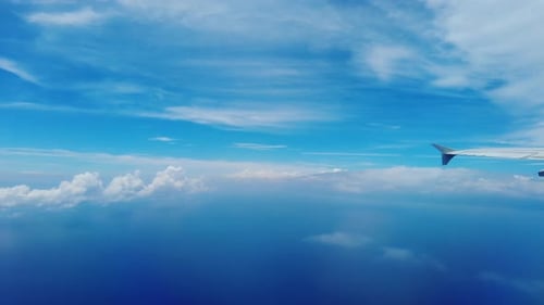 Airplane Wing Over Tropical Ocean