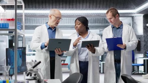 Scientists Working Together in Modern Laboratory