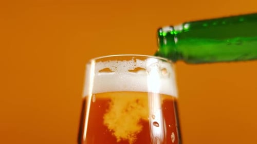Close Up of Beer Pouring into Glass