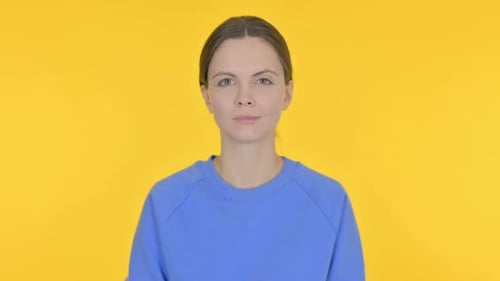 Young Woman Portrait on Yellow Background