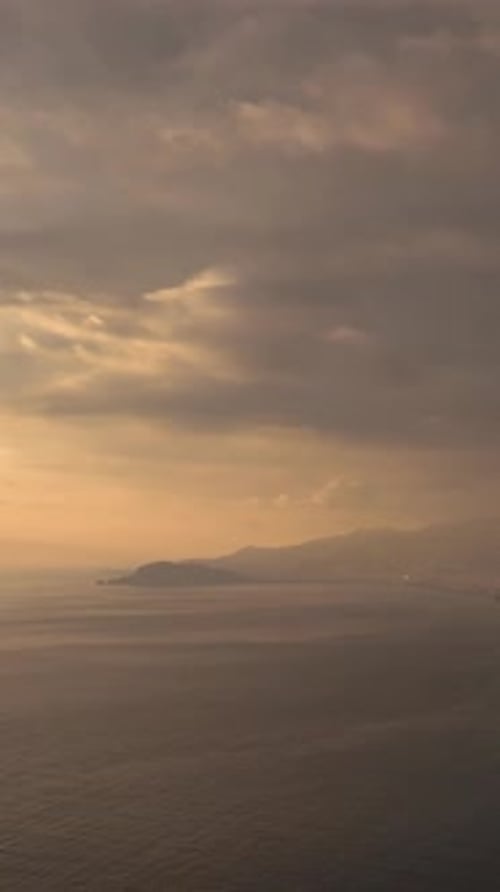 Vertical Video Above the Horizon Aerial View of a Picturesque Sea Sunset